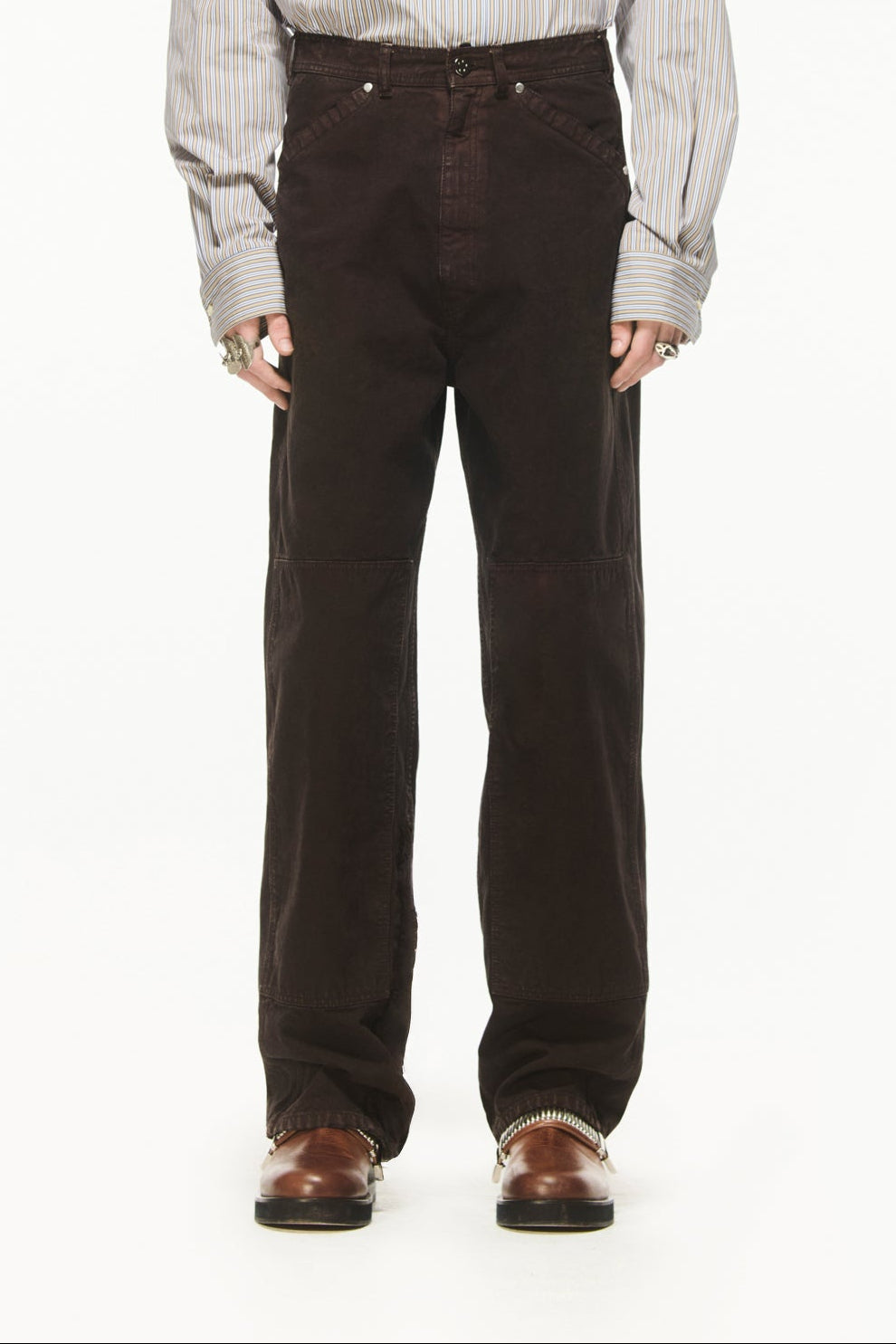 BLUEMARBLE garment-dyed brown canvas workwear pants featuring a relaxed fit, high-rise waist, knee patch panels, five-pocket construction, belt loops and zip fly closure.