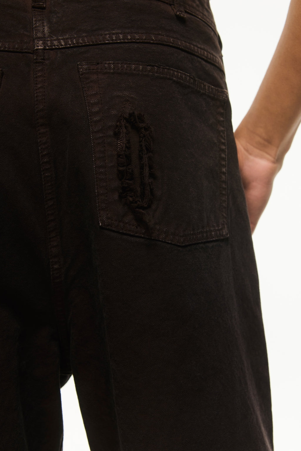 BLUEMARBLE garment-dyed brown canvas workwear pants featuring a relaxed fit, high-rise waist, knee patch panels, five-pocket construction, belt loops and zip fly closure.