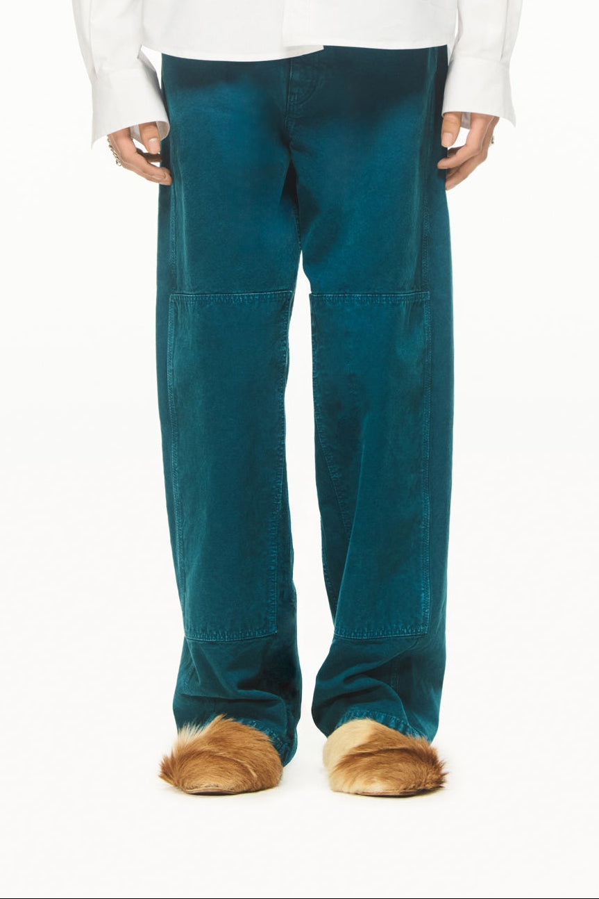 BLUEMARBLE garment-dyed duck green canvas workwear pants featuring a relaxed fit, high-rise waist, knee patch panels, five-pocket construction, belt loops and zip fly closure.