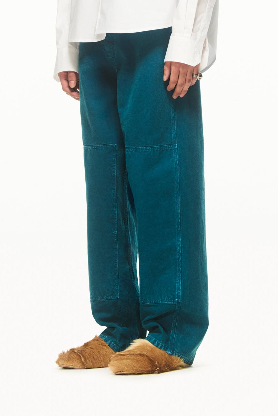 BLUEMARBLE garment-dyed duck green canvas workwear pants featuring a relaxed fit, high-rise waist, knee patch panels, five-pocket construction, belt loops and zip fly closure.