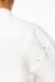 Zoom view of BLUEMARBLE white poplin shirt featuring molten metal studs along the shoulders and armholes, raw-edge detailing, a slightly oversized fit, chest patch pocket and button-down collar.