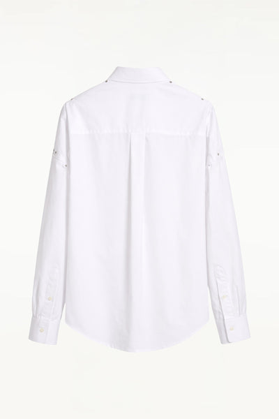 Back view of BLUEMARBLE white poplin shirt featuring molten metal studs along the shoulders and armholes, raw-edge detailing, a slightly oversized fit, chest patch pocket and button-down collar.